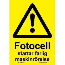 Varningsskylt. Fotocell startar farlig maskin
